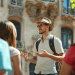 Male tourist guide showing European city to the group of tourists